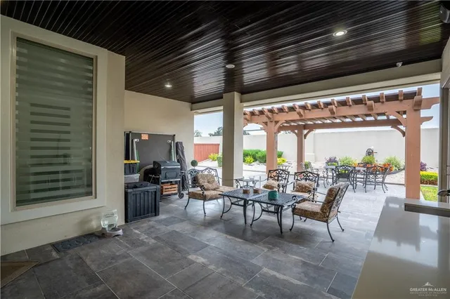 a outdoor space with lots of tables a garden and chairs