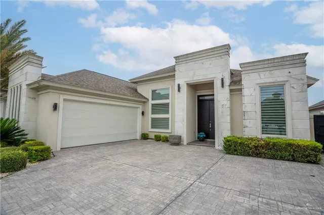 a view of a house with a garage
