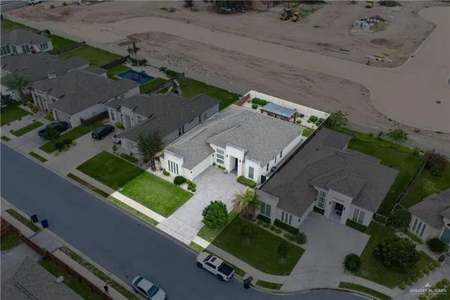 an aerial view of house with a yard