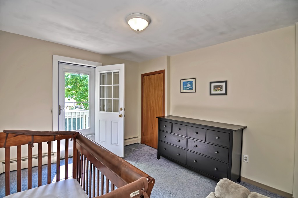61 Reed Street, Unit 61 Cambridge, MA 02140 - Photo 12 of 22 a view of livingroom with furniture and window