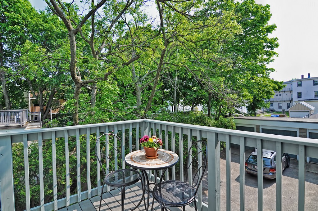 61 Reed Street, Unit 61 Cambridge, MA 02140 - Photo 21 of 22 a view of a chair and table in the balcony