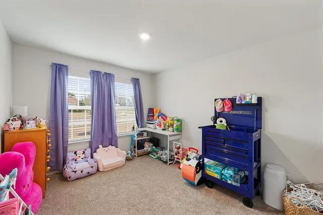 a bed room with furniture and a window