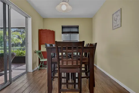 a bathroom with a granite countertop sink a mirror and a toilet