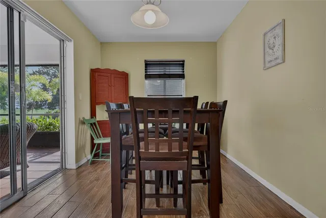 a bathroom with a granite countertop sink a mirror and a toilet