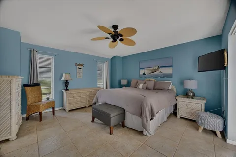 a spacious bathroom with a toilet a sink and a mirror