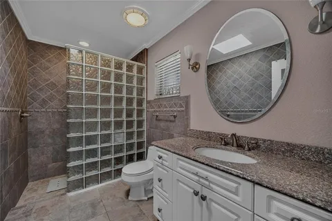 a bathroom with a shower toilet and sink