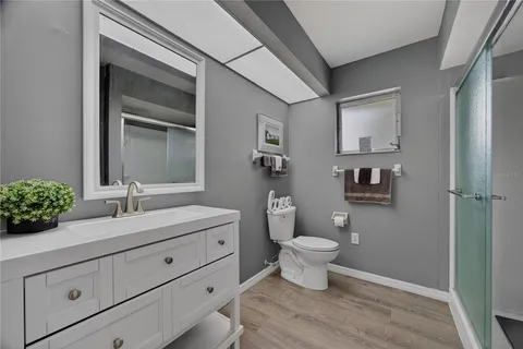 a living room filled with furniture and a floor to ceiling window