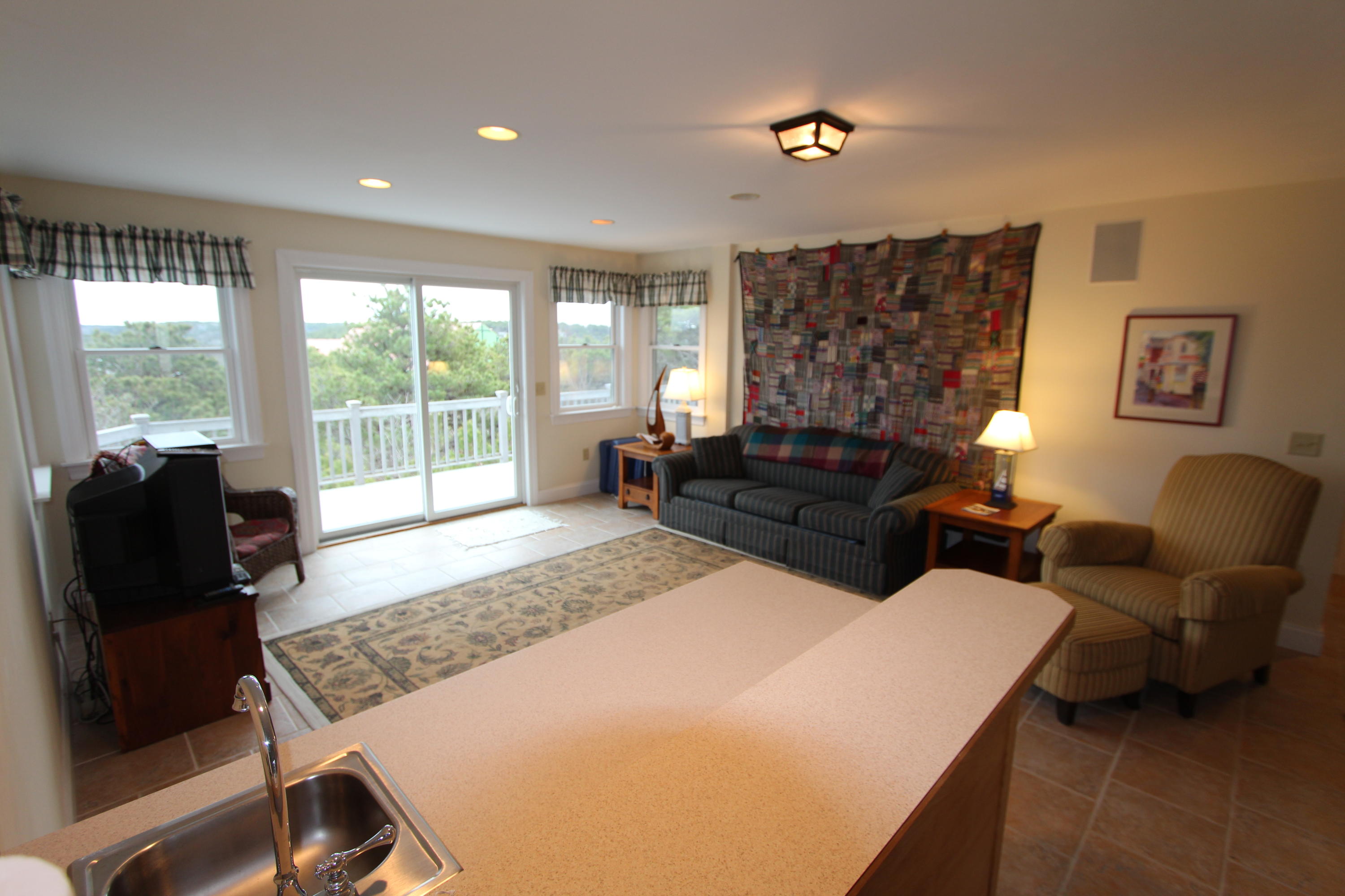 4 High Ridge Rd Extension Truro, MA 02666 - Photo 17 of 46 a living room with furniture and a flat screen tv