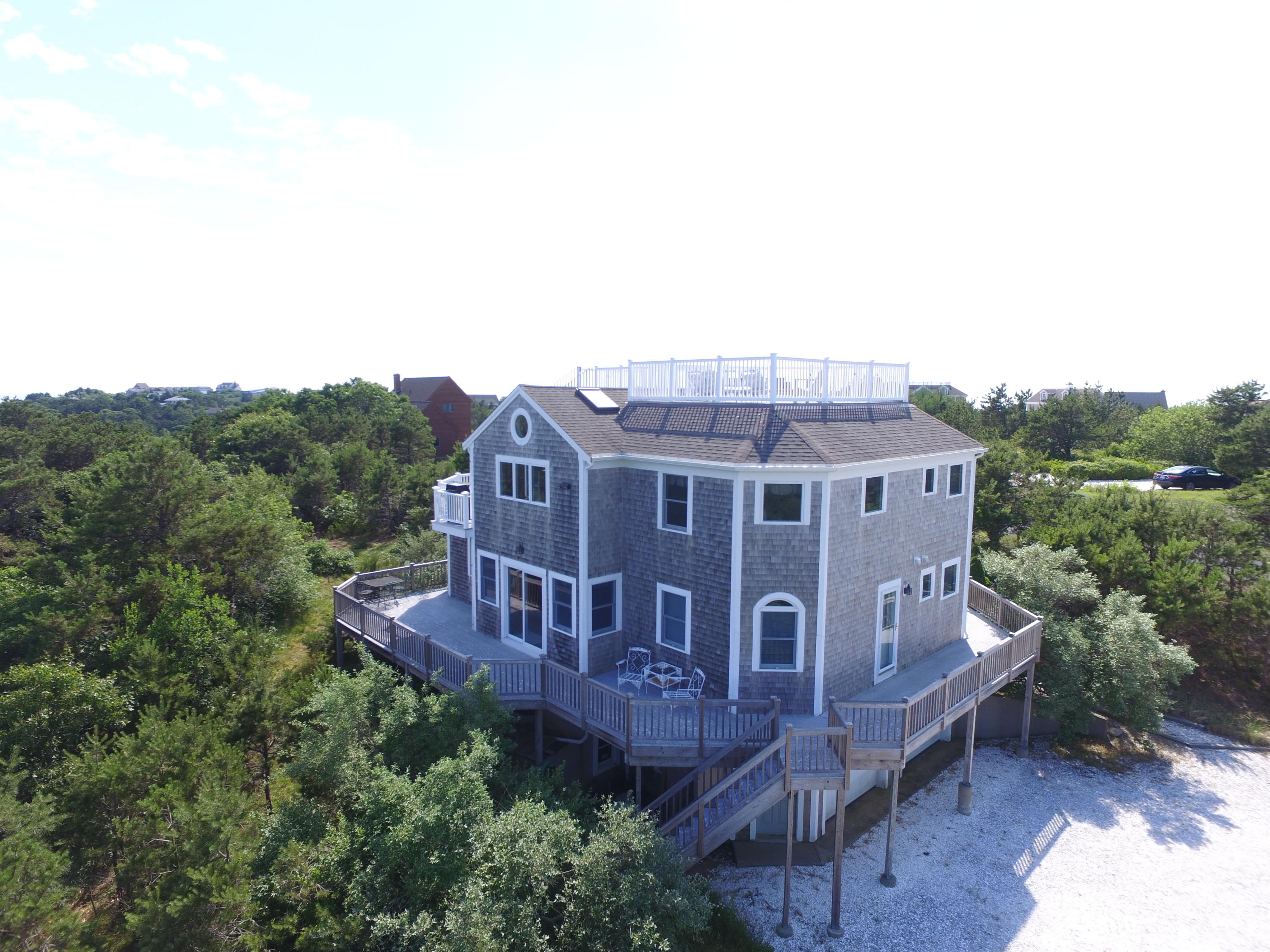 4 High Ridge Rd Extension Truro, MA 02666 - Photo 43 of 46 a view of a house with a big yard plants and large trees