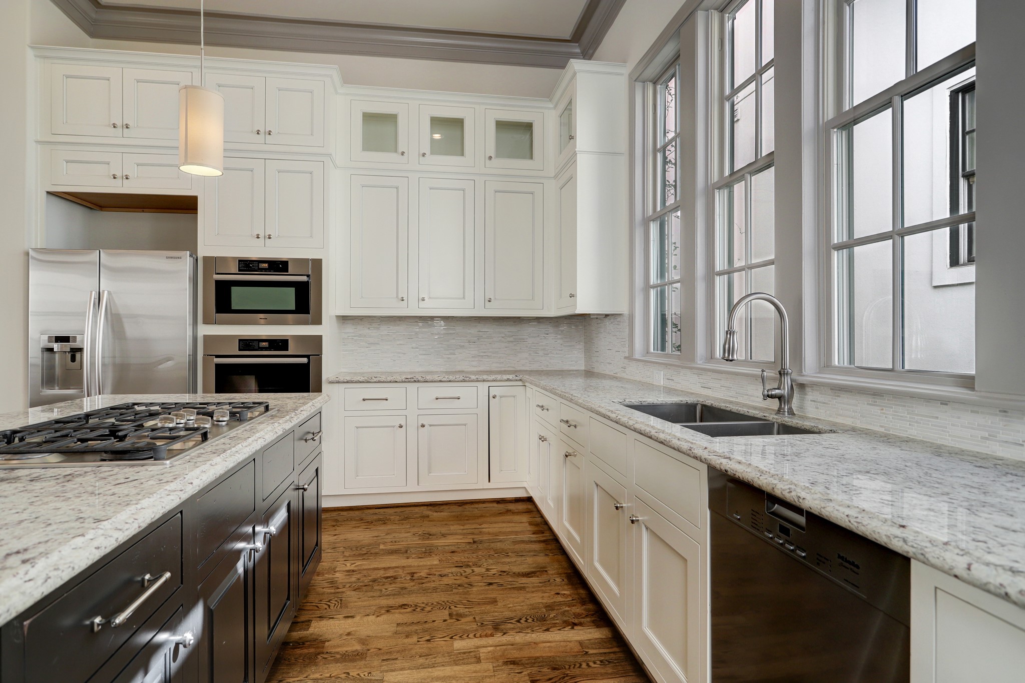 4838 Austin Street Houston, TX 77004 - Photo 13 of 27 a kitchen with stainless steel appliances granite countertop a sink stove and cabinets