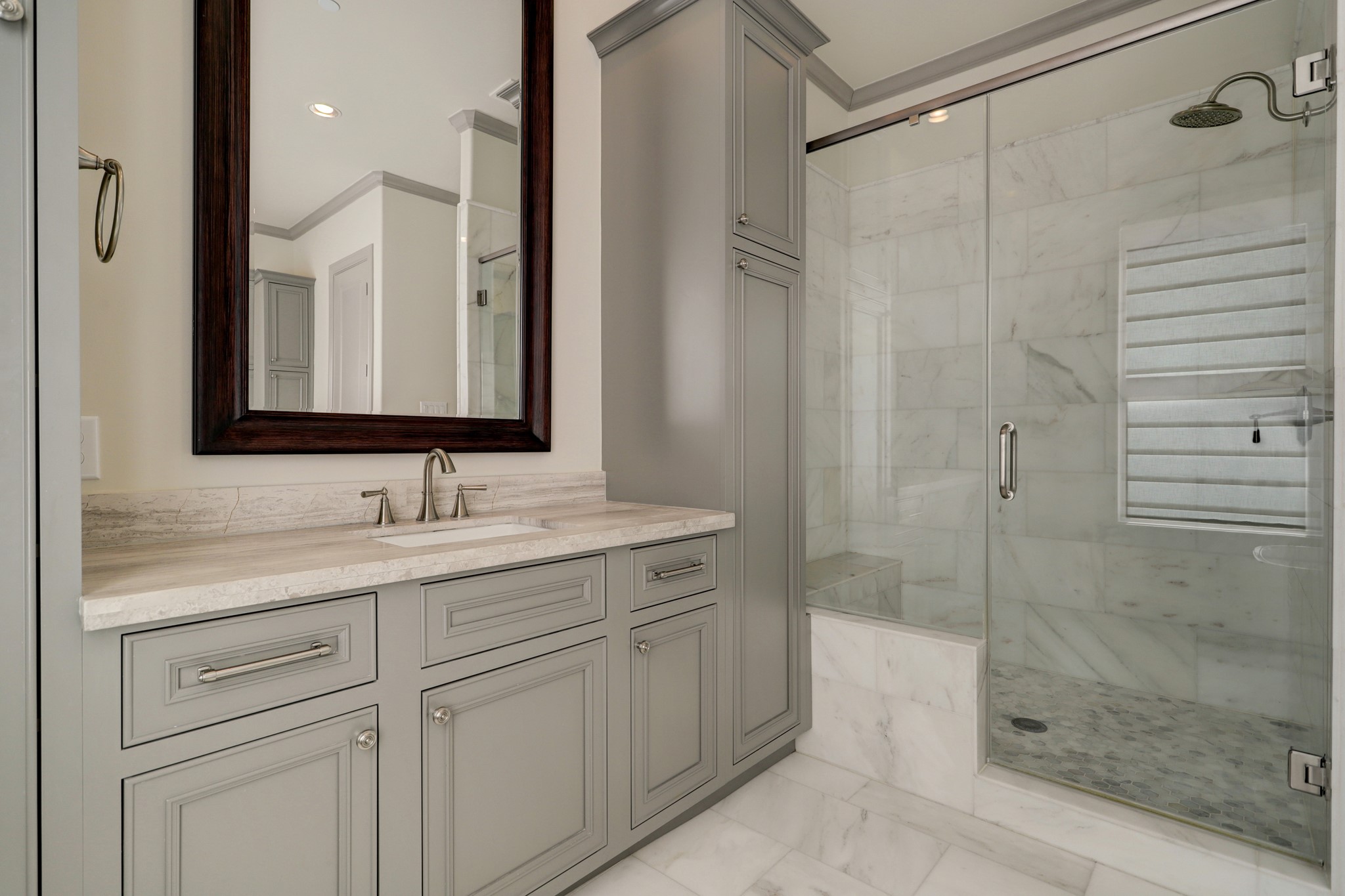 4838 Austin Street Houston, TX 77004 - Photo 16 of 27 a bathroom with a shower sink and mirror