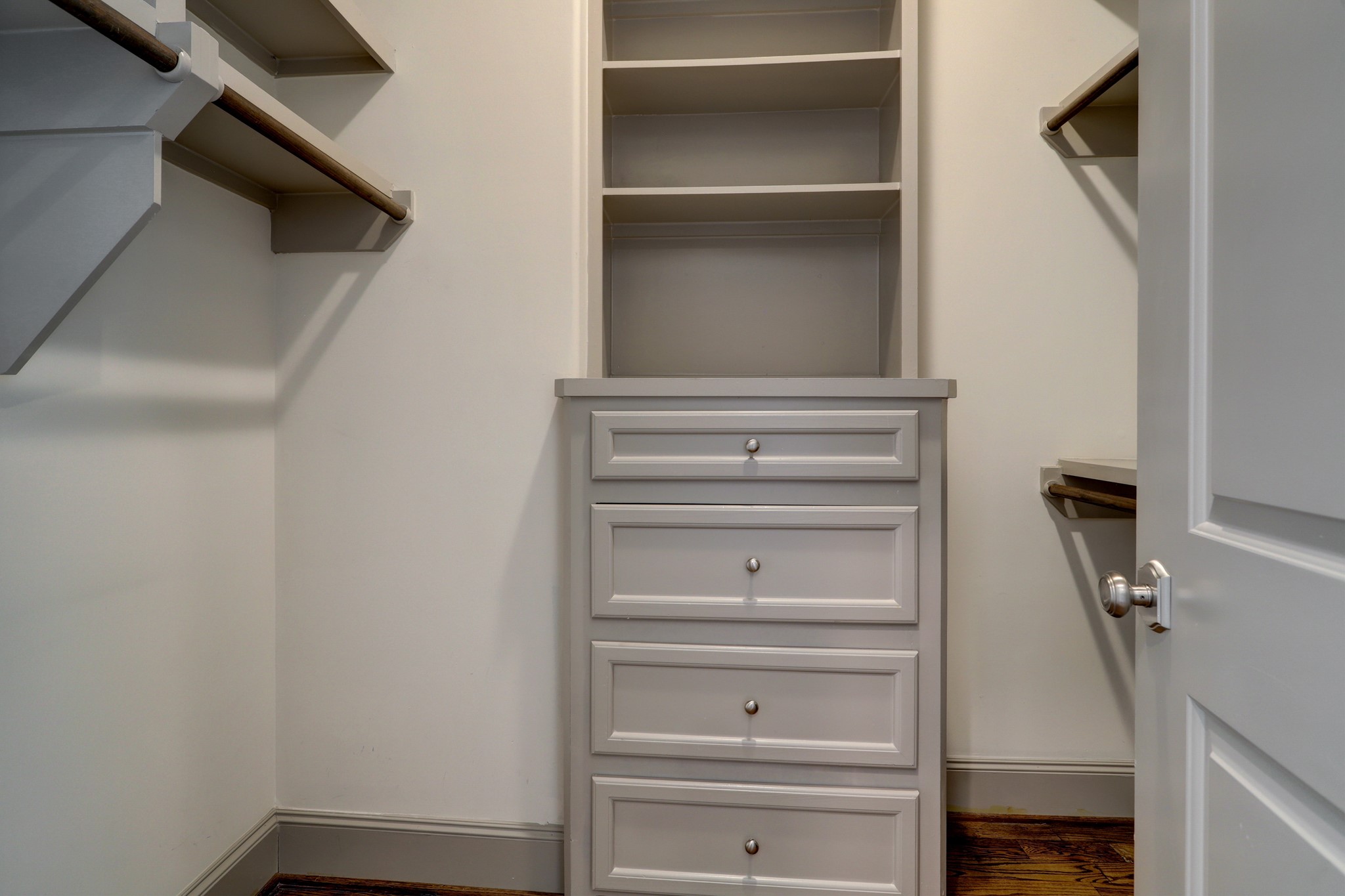 4838 Austin Street Houston, TX 77004 - Photo 18 of 27 a view of walk in closet with empty racks