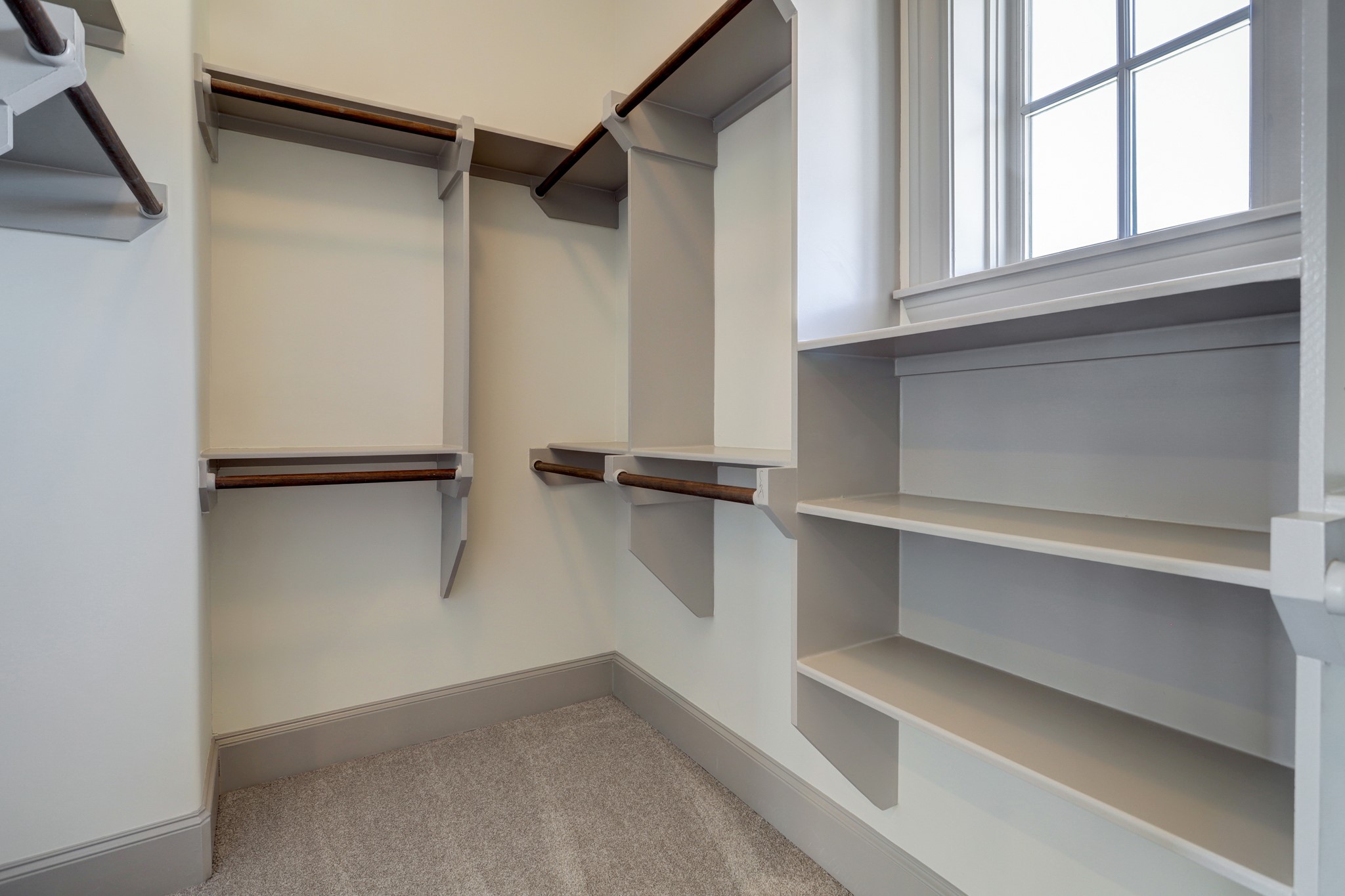 4838 Austin Street Houston, TX 77004 - Photo 24 of 27 a view of walk in closet with empty racks