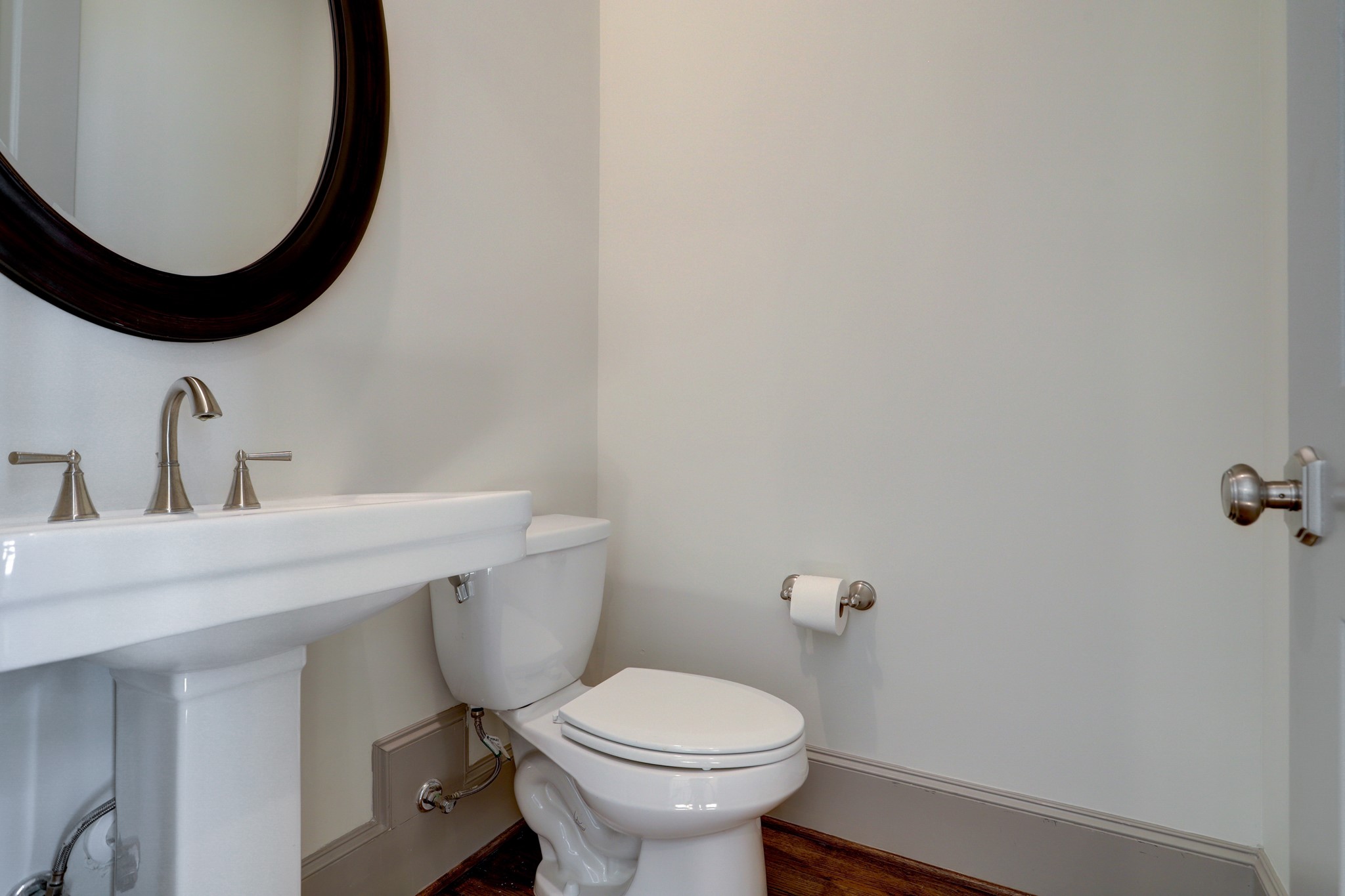 4838 Austin Street Houston, TX 77004 - Photo 7 of 27 a bathroom with a toilet a sink and mirror