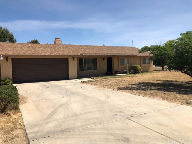 21128 Tussing Ranch Road Apple Valley, CA 92308 - Photo 1 of 1 a backyard of a house