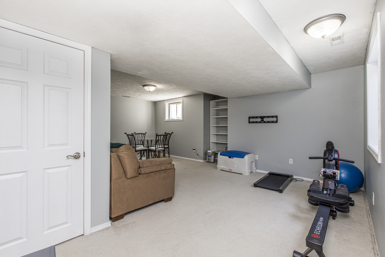 3230 Turquois Way Normal, IL 61761 - Photo 22 of 28 a living room with furniture and a gym machine