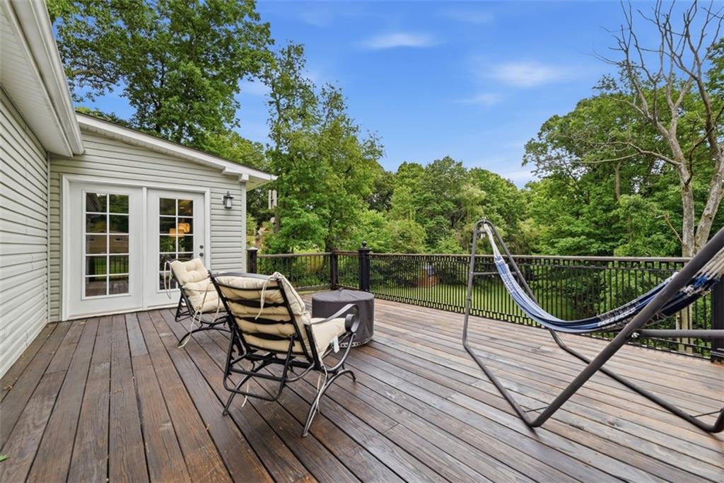 5380 Hardt Road Gibsonia, PA 15044 - Photo 36 of 49 The expansive back deck is a serene spot to enjoy the view of the rolling back yard and woods.