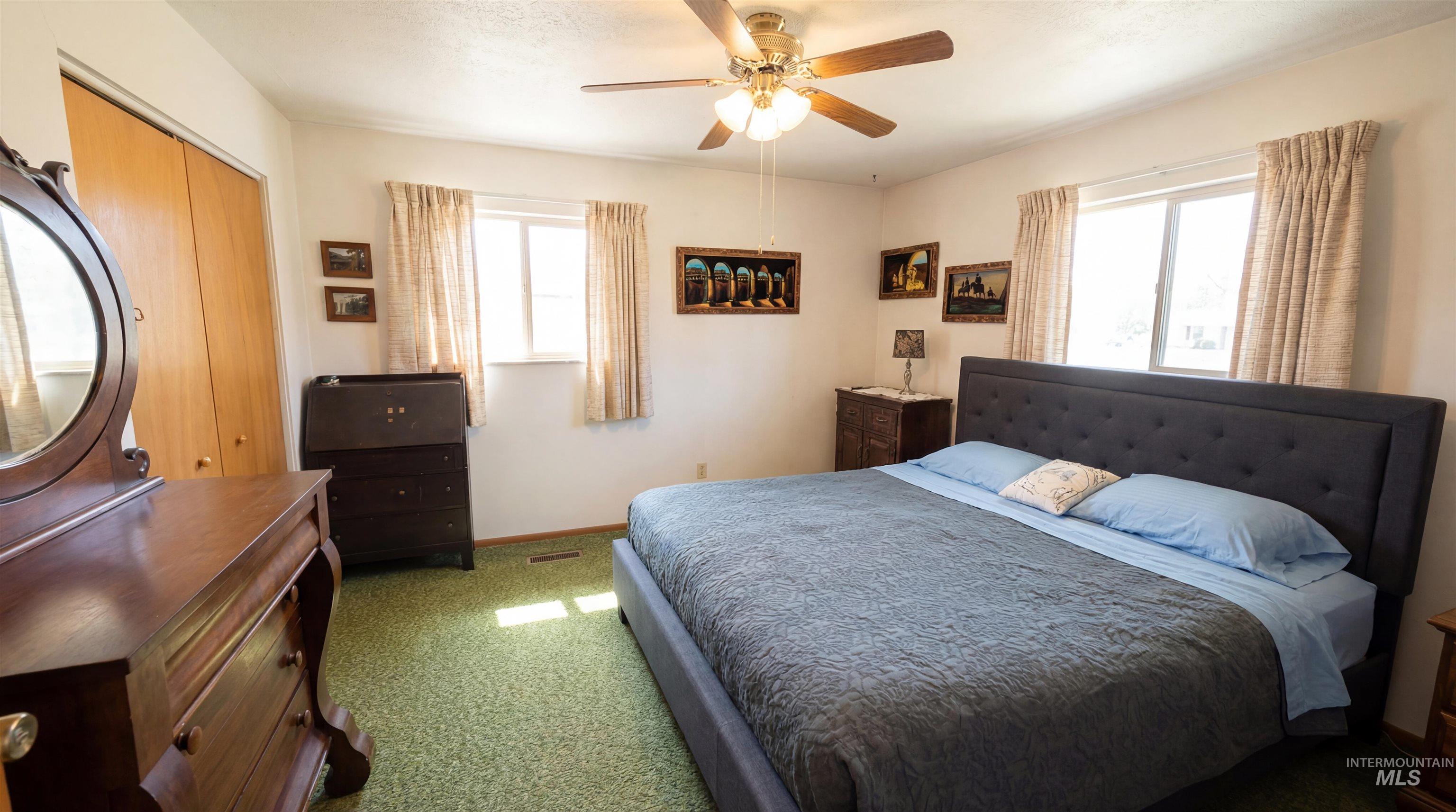 19076 Pleasant Avenue Caldwell, ID 83607 - Photo 18 of 37 Bedroom with a closet, carpet floors, and a ceiling fan