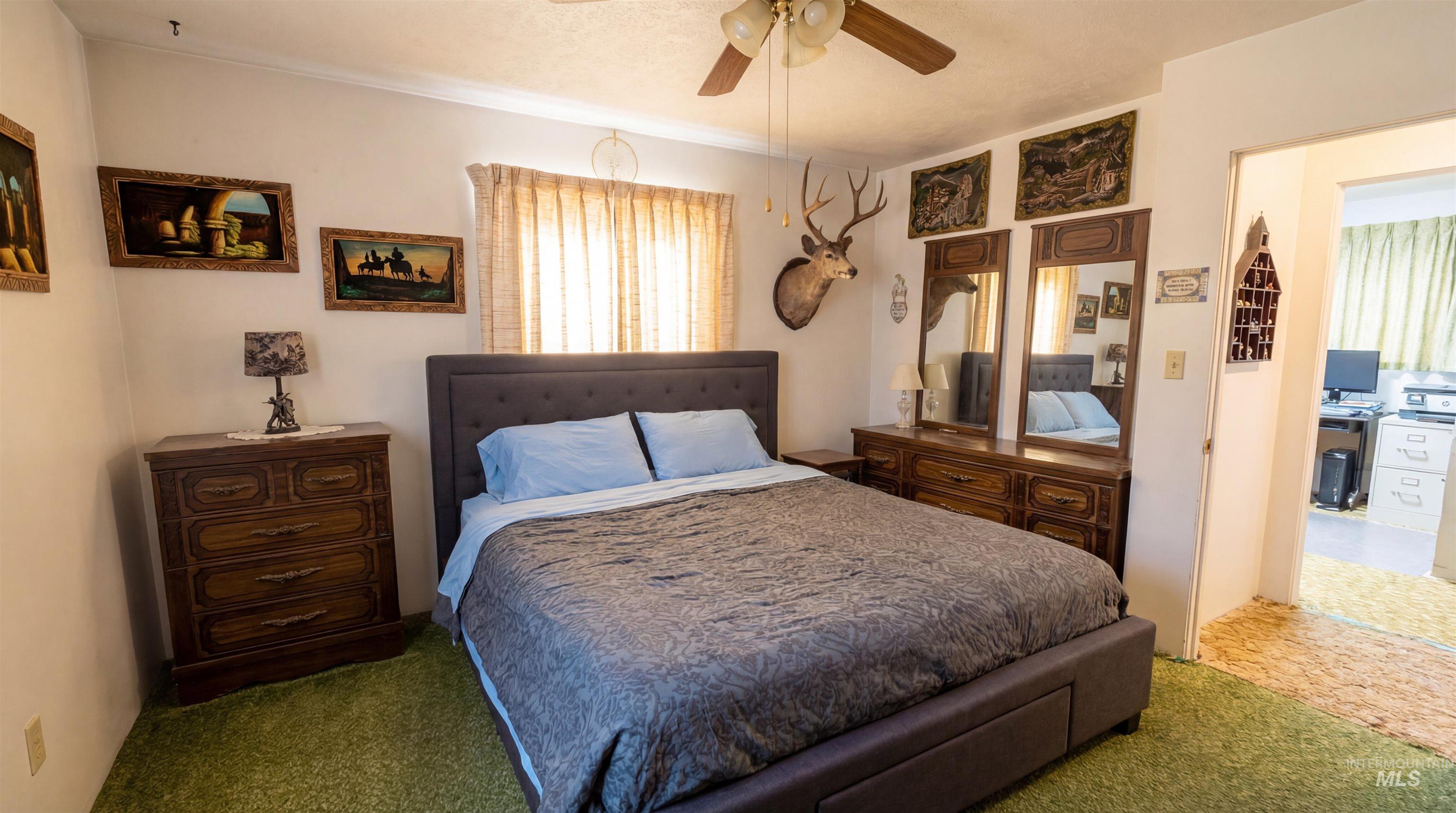 19076 Pleasant Avenue Caldwell, ID 83607 - Photo 19 of 37 Bedroom with carpet and a ceiling fan