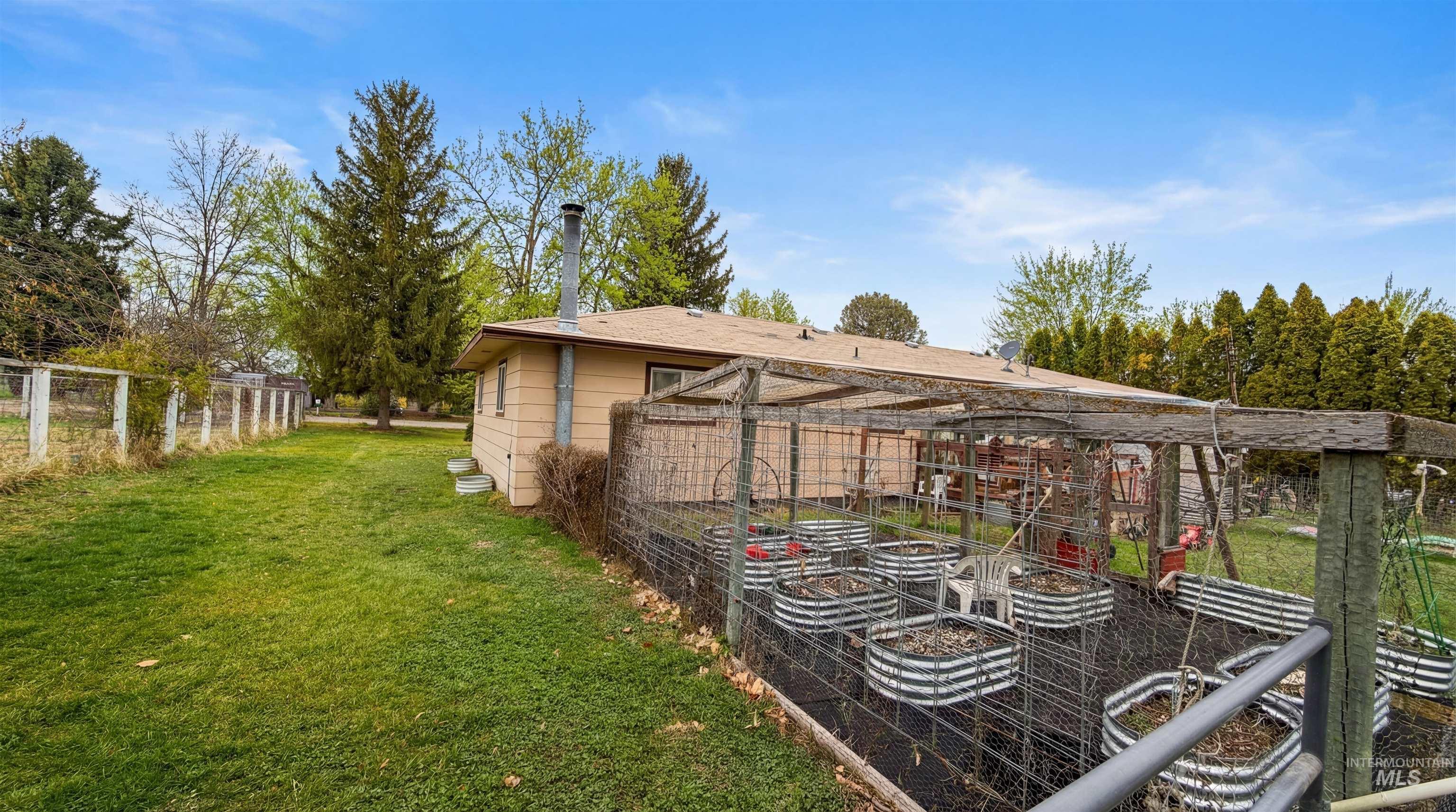 19076 Pleasant Avenue Caldwell, ID 83607 - Photo 34 of 37 View of yard featuring a vegetable garden
