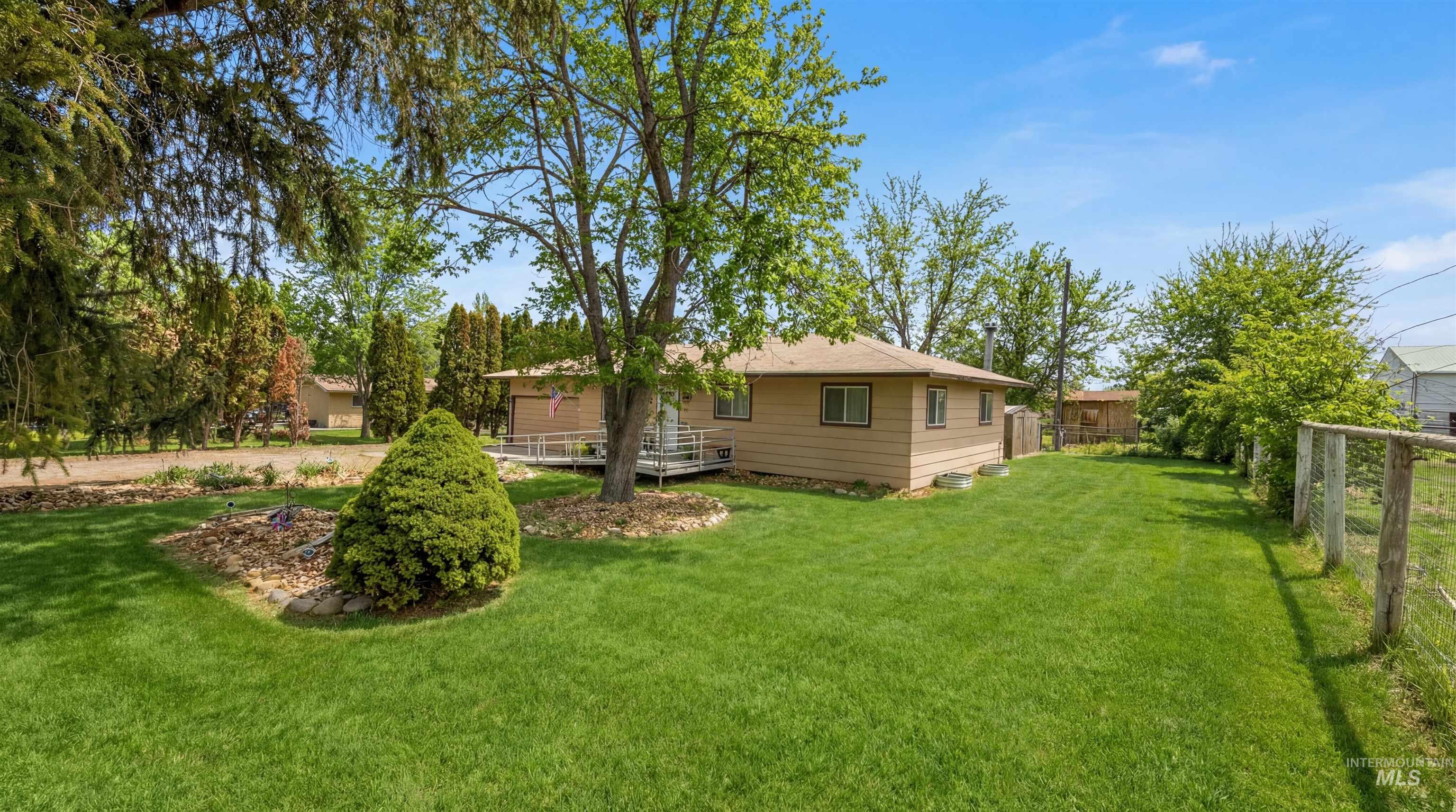 19076 Pleasant Avenue Caldwell, ID 83607 - Photo 36 of 37 View of yard with a wooden deck