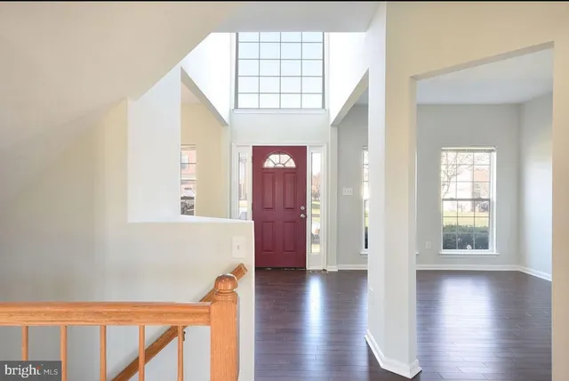 a view of an entryway with wooden floor