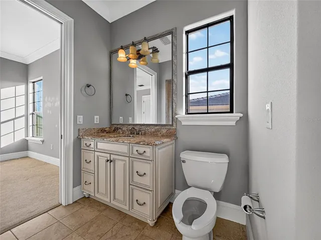 a bathroom with a toilet a sink and a shower