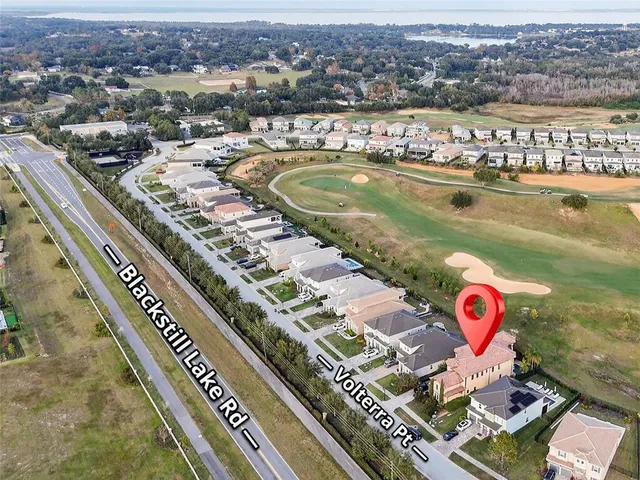 a view of a swimming pool with a yard