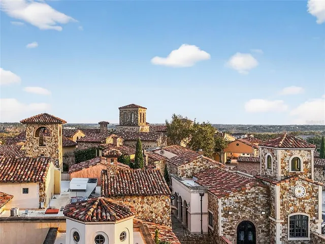 a multi story building with an outdoor seating