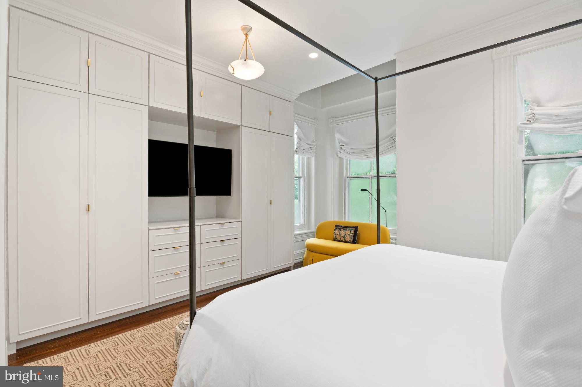 1333 30th Street Northwest Washington, DC 20007 - Photo 13 of 26 a bedroom with a bed and a flat tv screen