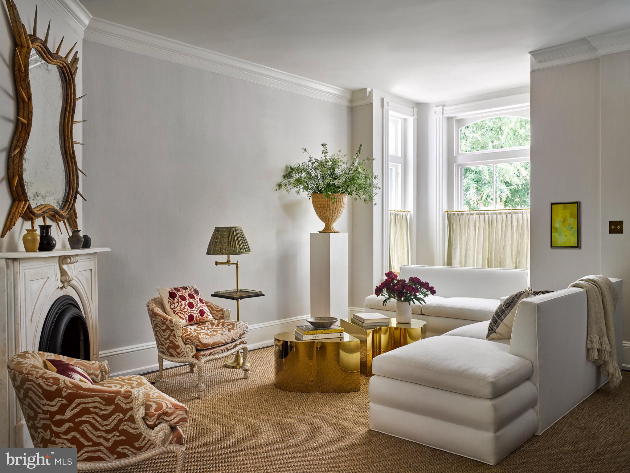 1333 30th Street Northwest Washington, DC 20007 - Photo 2 of 26 a living room with furniture a fireplace and a floor to ceiling window