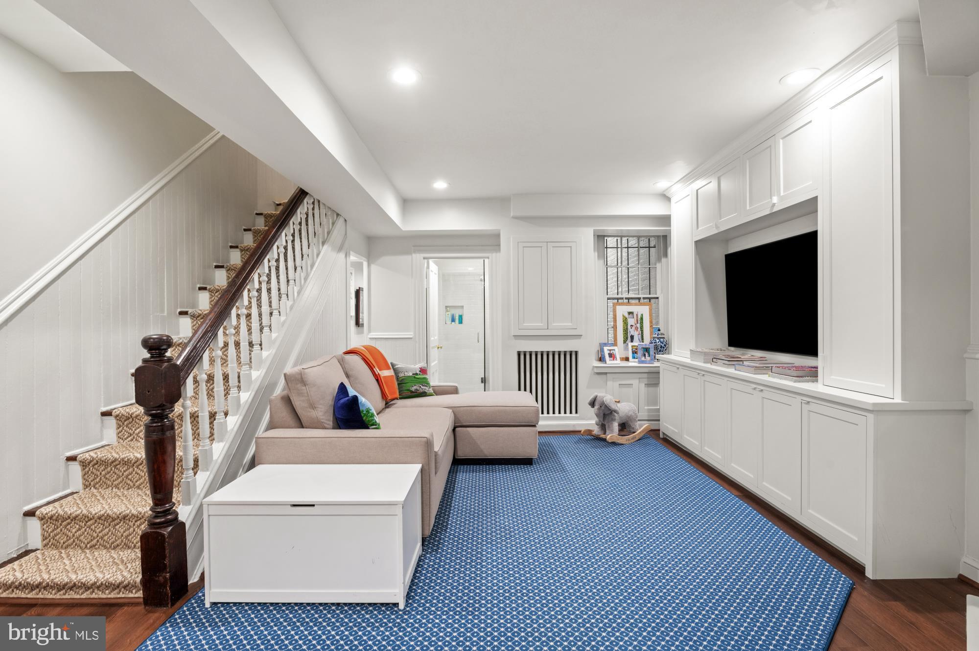 1333 30th Street Northwest Washington, DC 20007 - Photo 22 of 26 a living room with furniture and a flat screen tv
