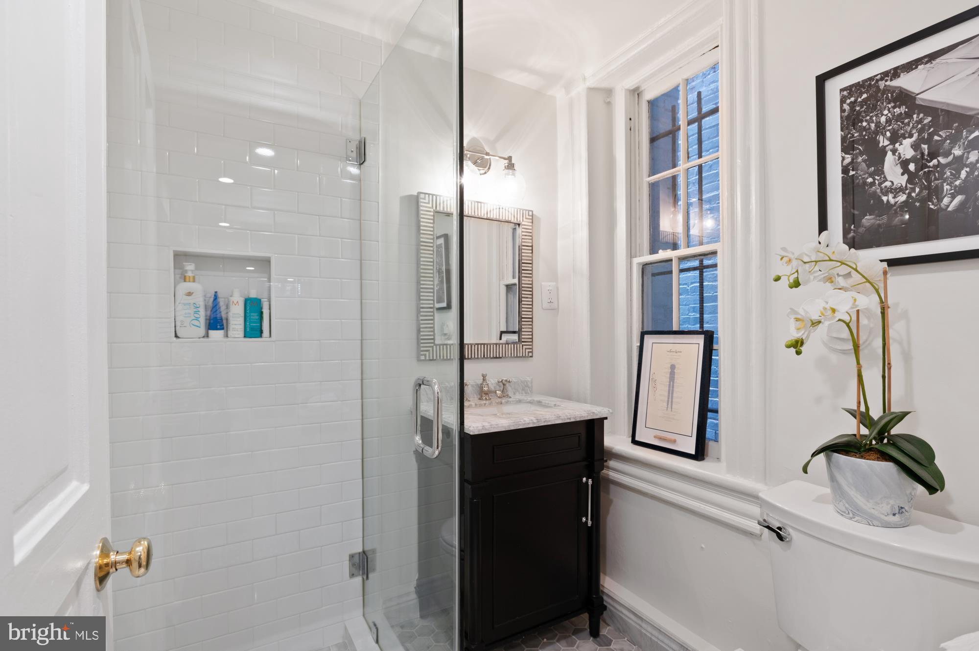 1333 30th Street Northwest Washington, DC 20007 - Photo 24 of 26 a bathroom with a sink double vanity and shower