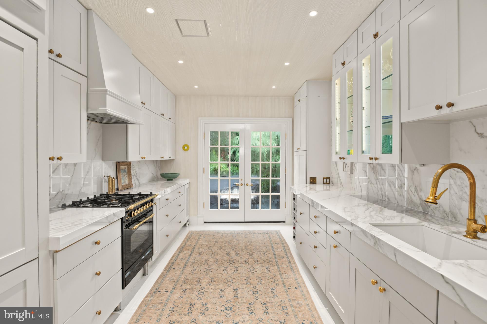1333 30th Street Northwest Washington, DC 20007 - Photo 9 of 26 a large kitchen with stainless steel appliances granite countertop a lot of counter space and a sink