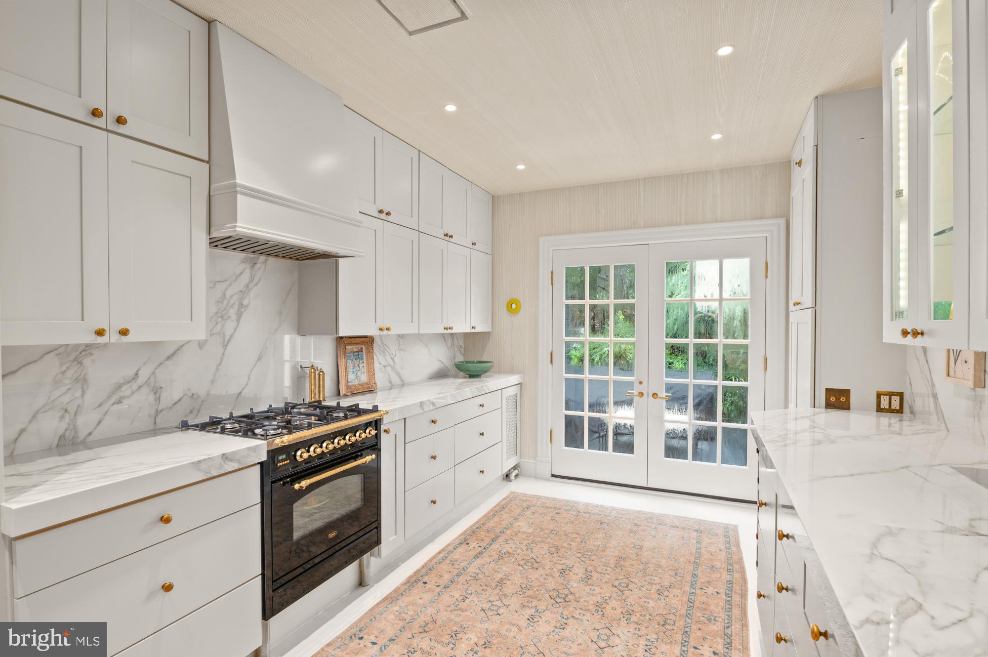 1333 30th Street Northwest Washington, DC 20007 - Photo 10 of 26 a kitchen with stainless steel appliances granite countertop a stove and a sink