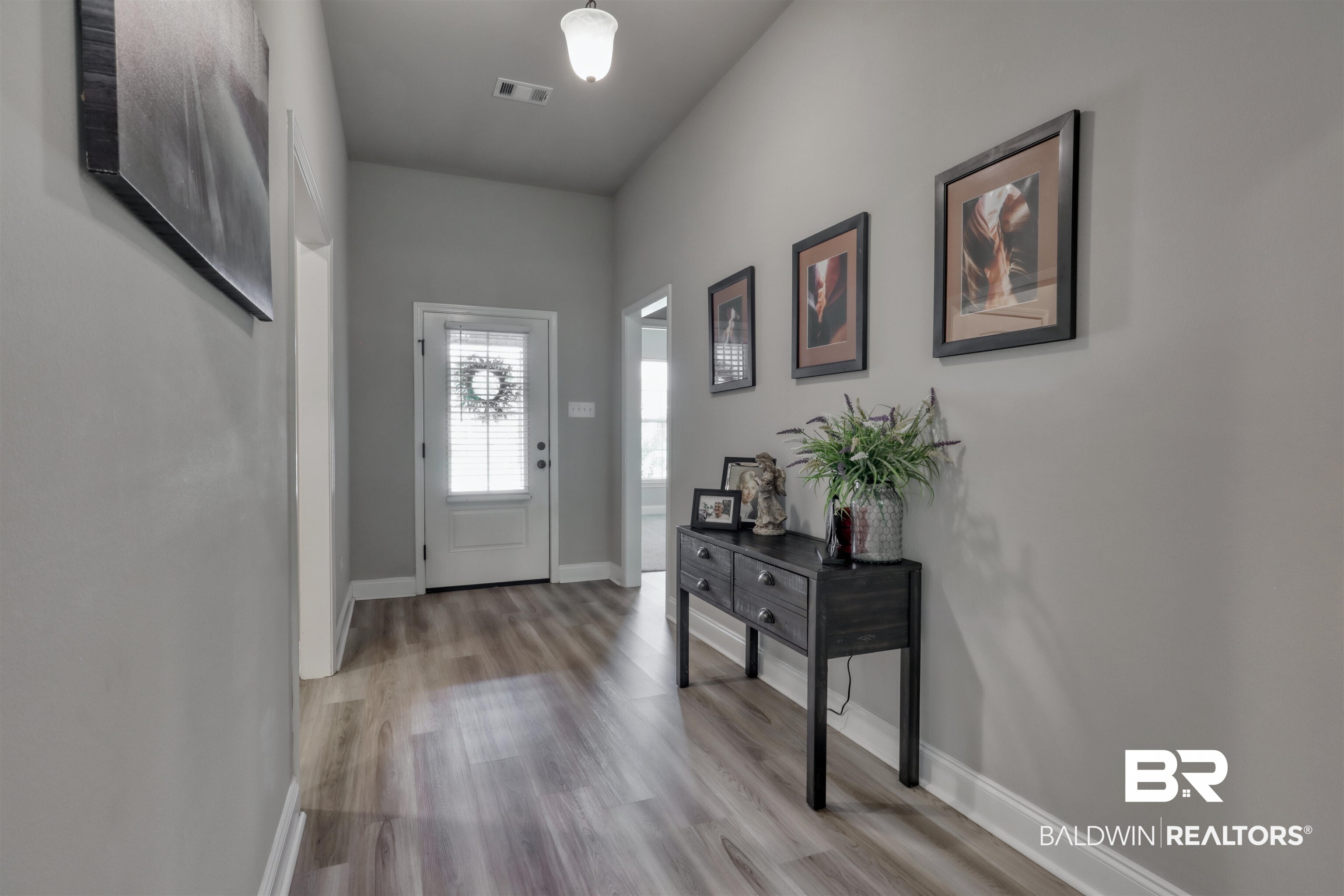 987 Gibson Court Foley, AL 36535 - Photo 6 of 34 Foyer entrance featuring baseboards, visible vents, and light wood finished floors