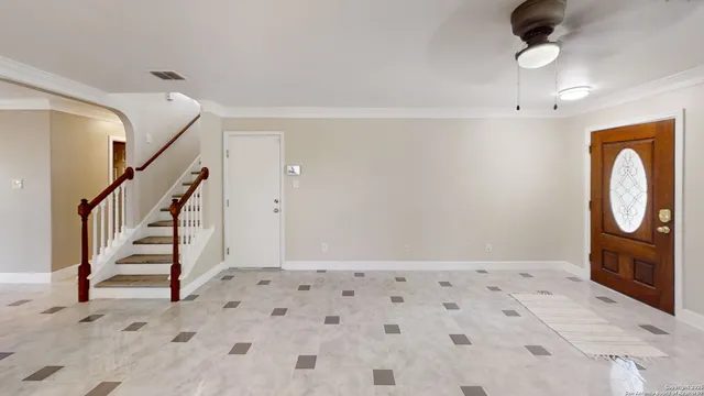 a view of an entryway with wooden floor