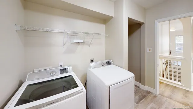 a utility room with dryer and washer