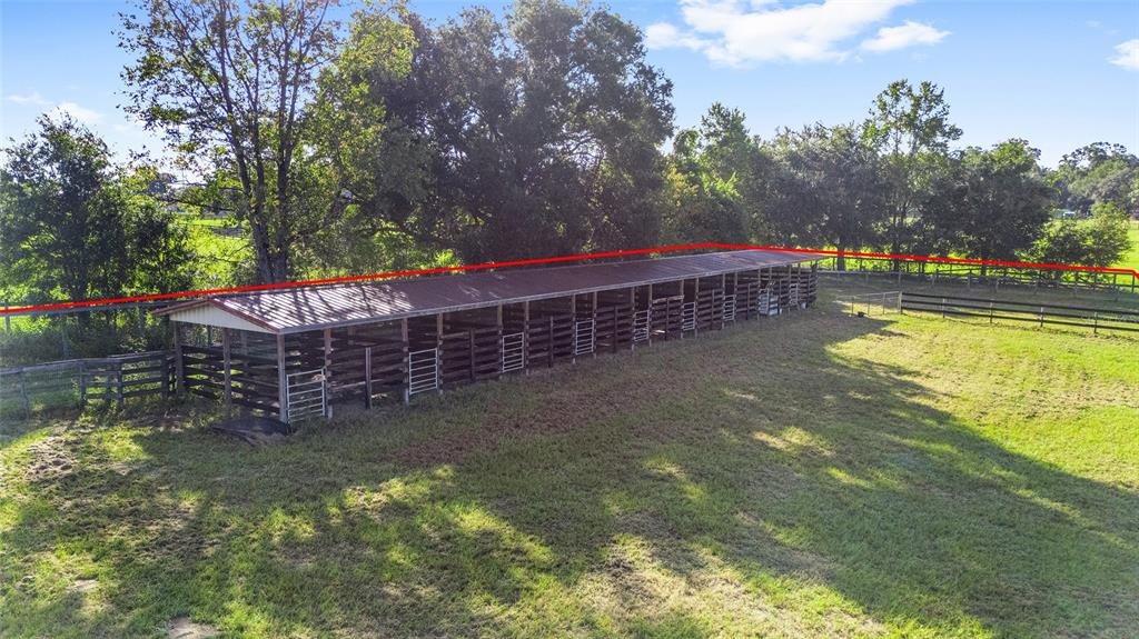 15269 Northeast 15th Court Citra, FL 32113 - Photo 6 of 17 a backyard of a house with lots of green space and fountain