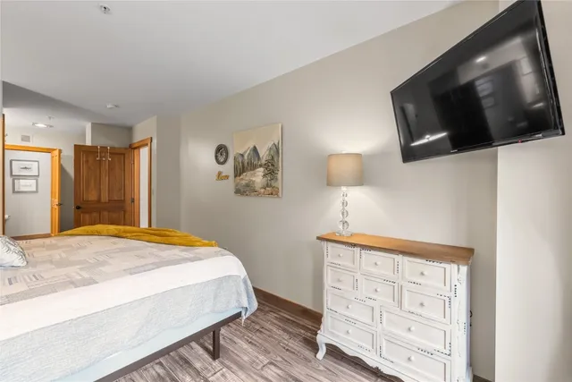 a spacious bathroom with a double vanity sink mirror and a toilet