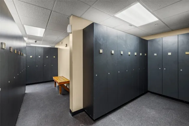 a living room with furniture a pool table and a fireplace