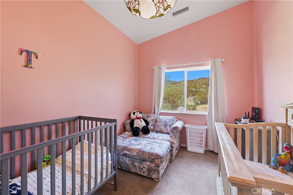 61455 Indian Paint Brush Road Anza, CA 92539 - Photo 20 of 60 a bedroom with a bed and a window