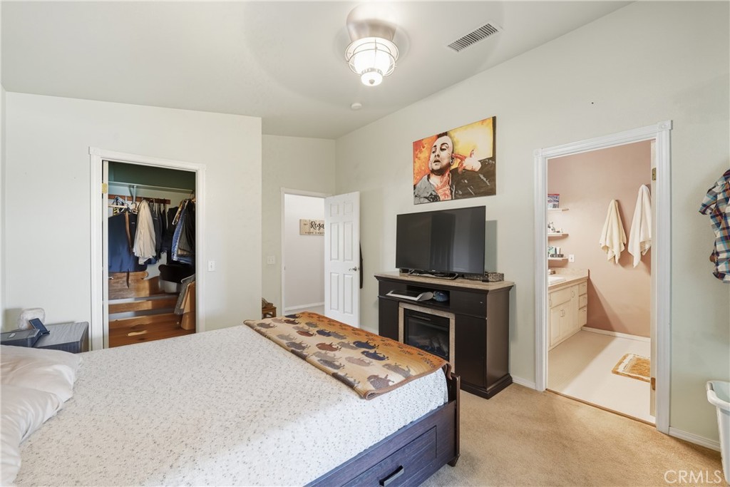 61455 Indian Paint Brush Road Anza, CA 92539 - Photo 26 of 60 a bedroom with a bed and a flat screen tv