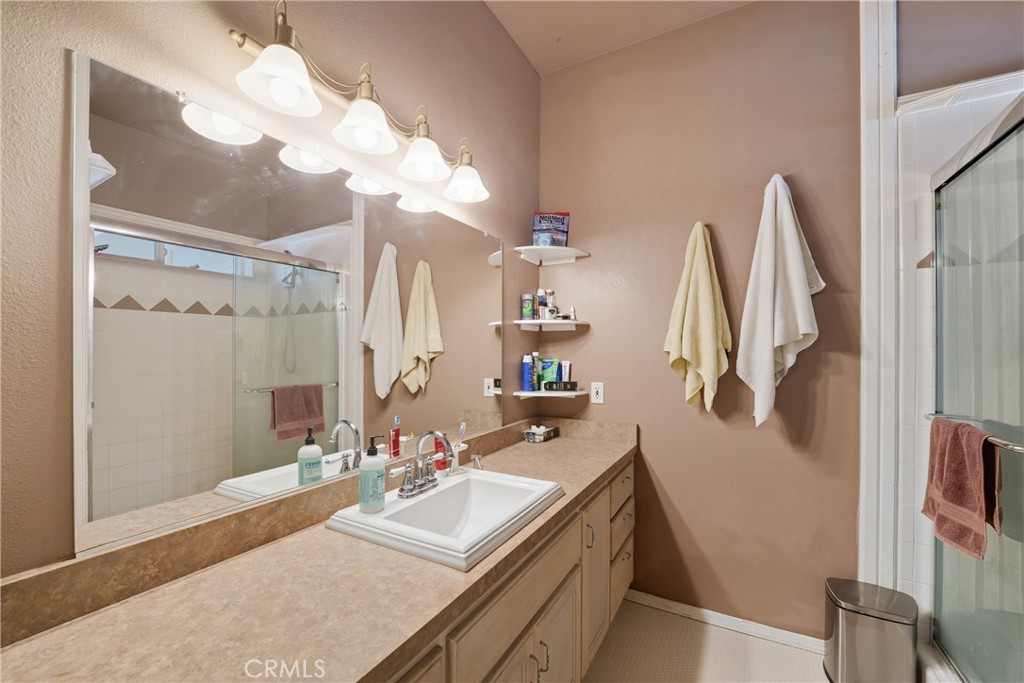 61455 Indian Paint Brush Road Anza, CA 92539 - Photo 28 of 60 a bathroom with a sink vanity and a mirror