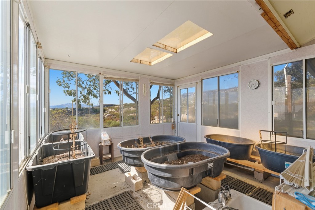 61455 Indian Paint Brush Road Anza, CA 92539 - Photo 32 of 60 a room with furniture a large window and glass door