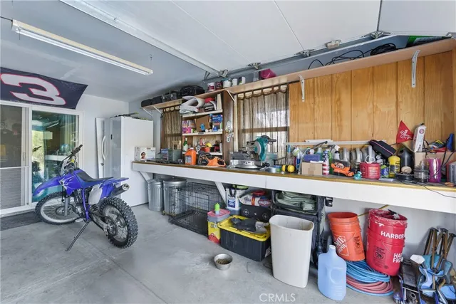 a view of a balcony with chairs and wooden floor