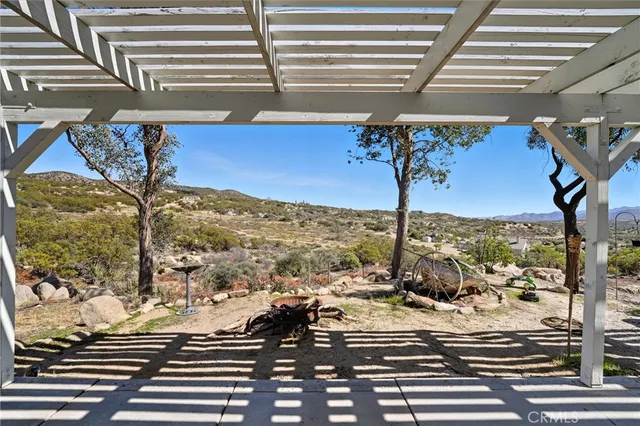 a view of a house with a snow in the yard