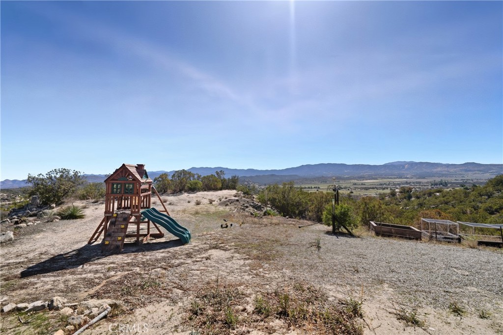 61455 Indian Paint Brush Road Anza, CA 92539 - Photo 46 of 60 a view of a dry yard with mountain and trees