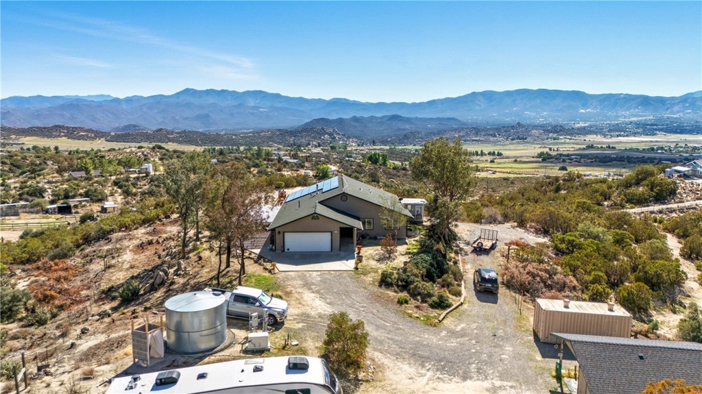 61455 Indian Paint Brush Road Anza, CA 92539 - Photo 60 of 60 a view of a terrace with a table and chairs under an umbrella