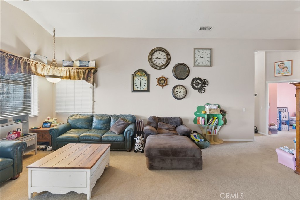 61455 Indian Paint Brush Road Anza, CA 92539 - Photo 7 of 60 a living room with patio furniture and a wooden floor